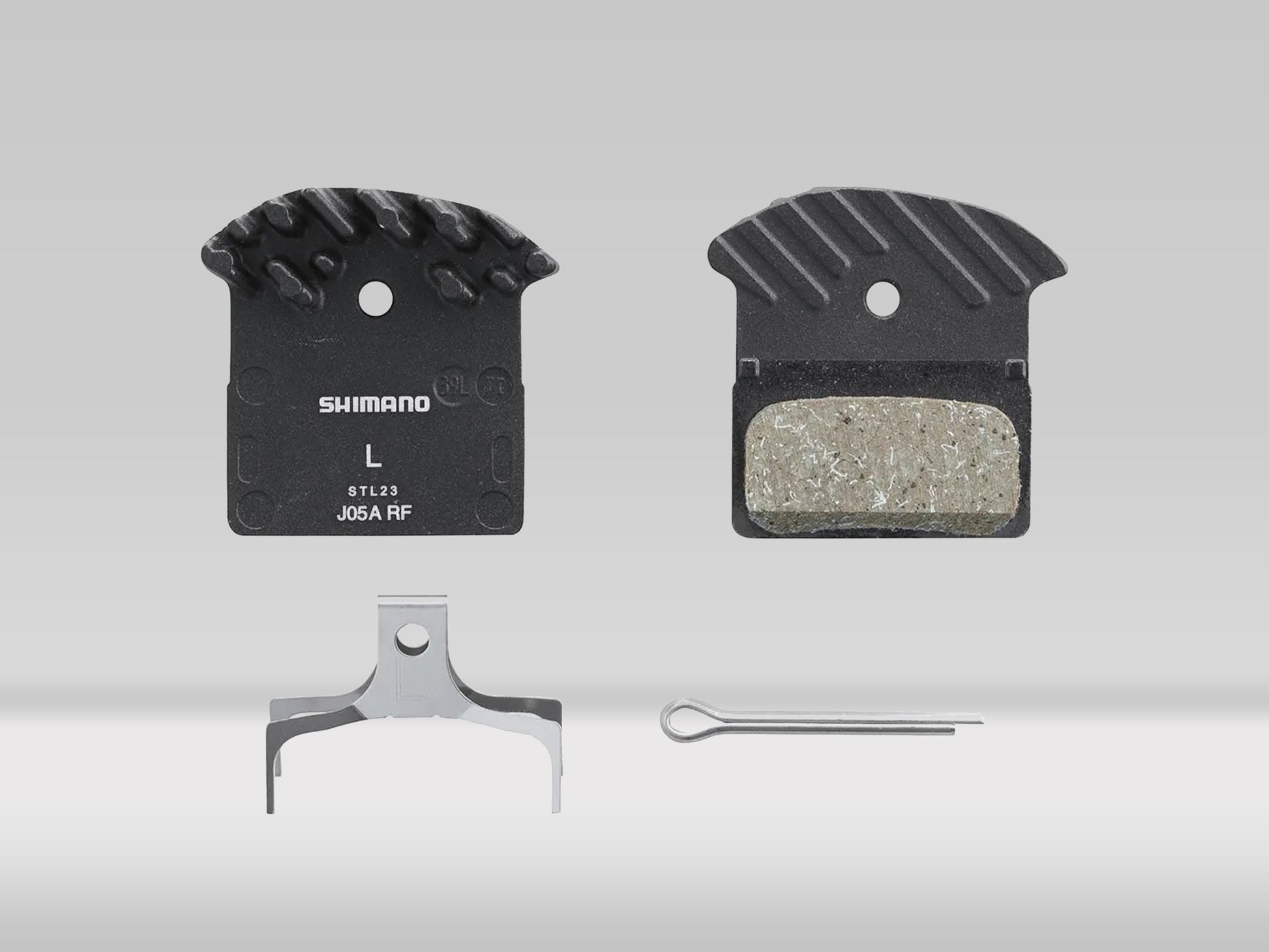 Shimano J05A resinbromsbelägg med kylfläns inkl. fjäder och saxsprint —  —